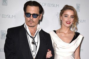 SANTA MONICA, CA - JANUARY 10:  Johnny Depp and Amber Heard arrives at the The Art Of Elysium 8th Annual Heaven Gala at Hangar 8 on January 10, 2015 in Santa Monica, California.  (Photo by Steve Granitz/WireImage)