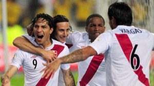 Peruvian Paolo Guerrero (L) celebrates with teammates Claudio Pizarro (2-L), Jefferson Farfan (2-R) and Juan Manuel Vargas after scoring against Paraguay during their Brazil 2014 World Cup South American qualifier match held at the Nacional stadium in Lima on October 7, 2011. AFP PHOTO/Ernesto Benavides