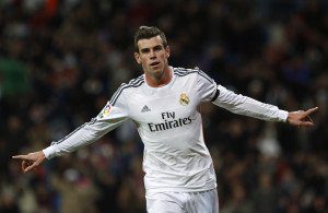 Real Madrid's Gareth Bale celebrates his goal against Real Valladolid during their Spanish First Division soccer match at Santiago Bernabeu stadium in Madrid November 30, 2013. REUTERS/Susana Vera (SPAIN - Tags: SPORT SOCCER) Picture Supplied by Action Images