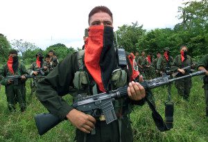 403785 04: National Liberation Army (ELN) soldiers stand in formation at one of their camps near the front line April 11, 2002 in the Arauca province of Colombia. The ELN guerrilla army said it was liberating 11 civilians, including politicians and a priest, as a sign of good faith to continue peace talks with the Colombian government. The freed hostages delivered a message from the ELN that demanded that the Colombian government reject U.S. assistance to protect a critical oil pipeline. (Photo by Carlos Villalon/Getty Images)