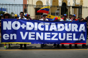Venezuelans living in Peru and other protesters take part in a rally against Venezuelan President Nicolas Maduro's government, outside the Venezuela embassy in Lima.